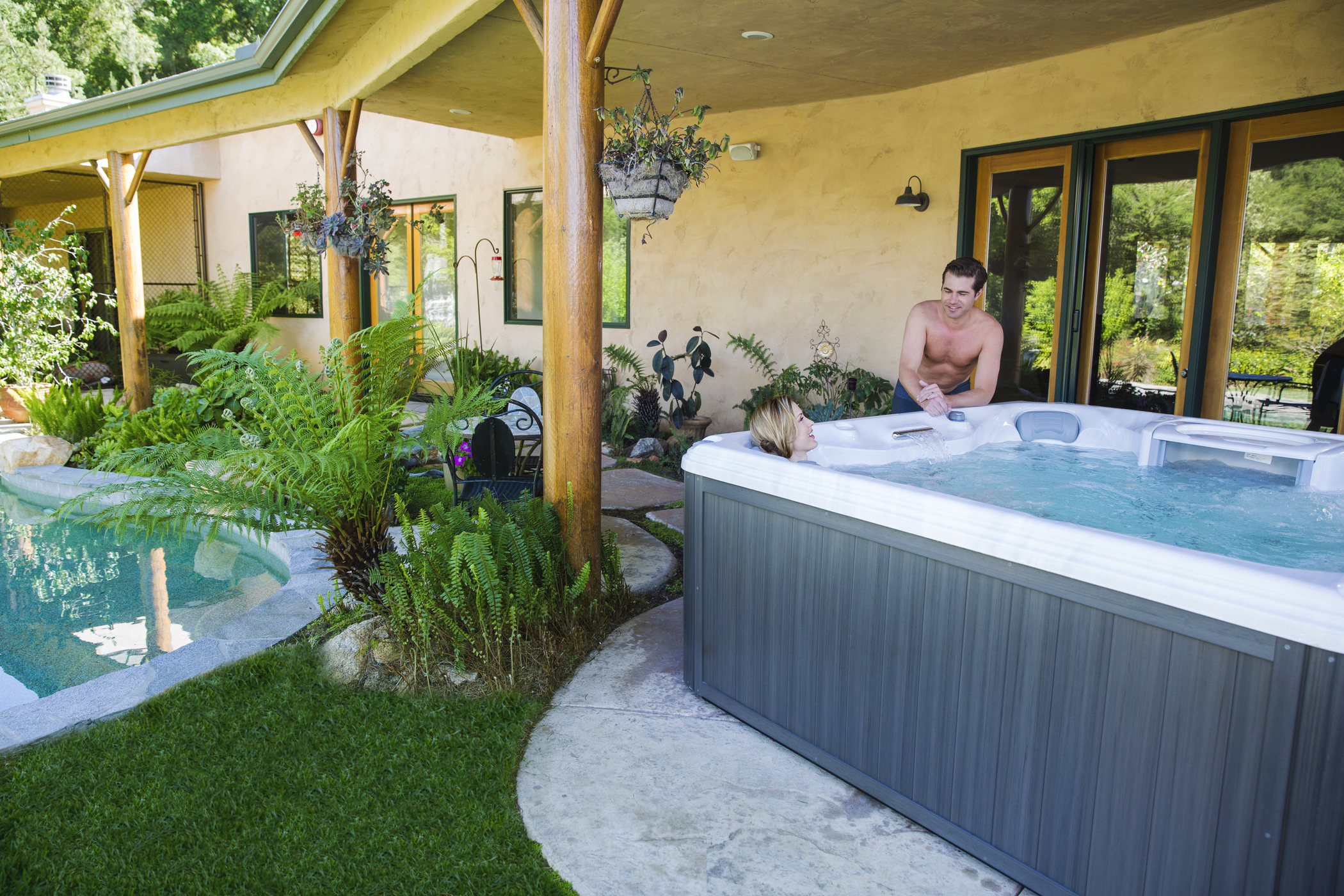 Woman soaking in a Sundance Spas hot tub.