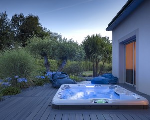 Outdoor hot tub installation at night.