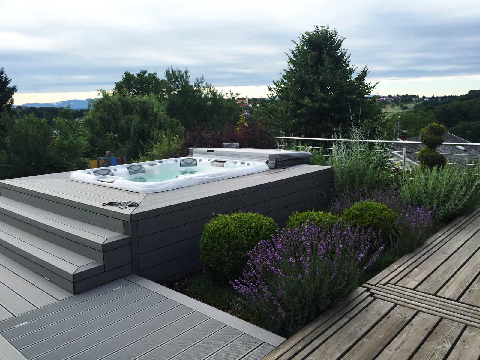 Outdoor hot tub installation on a deck.